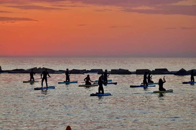 Barcelona: Paddleboarding at Sunrise. Includes: instructor, photos, equipment - Walking to San Miguel Beach