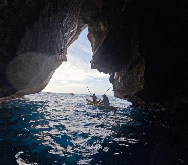 Cala en Porter: Menorca Caves Kayaking Tour & GoPro Photos - Inside the sea caves: light, rock, and careful access