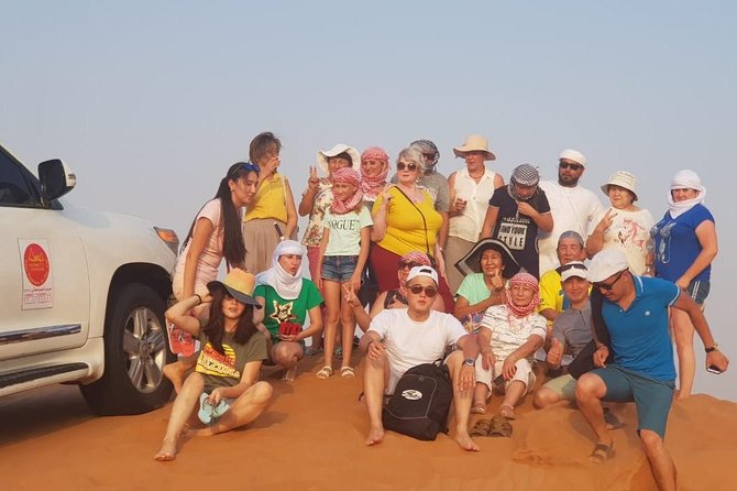 Dubai Half day Desert Safari Quad Bike & Flying Dress Photoshoot - Sandboarding, camel riding, and quad biking
