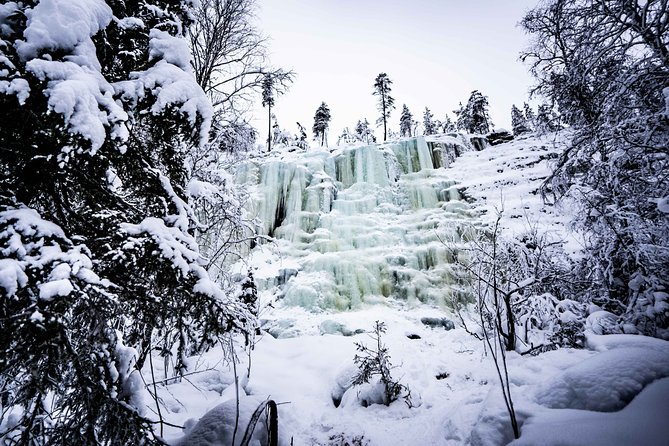 Frozen Waterfalls of Korouoma Canyon tour with Pro Photos & BBQ - Walking toward the frozen waterfalls