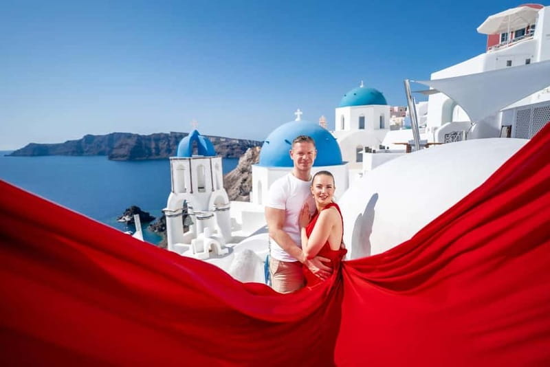 Oia: Santorini Photoshoot with Flying Dress Rental Option - Blue Domes and the Caldera Finish