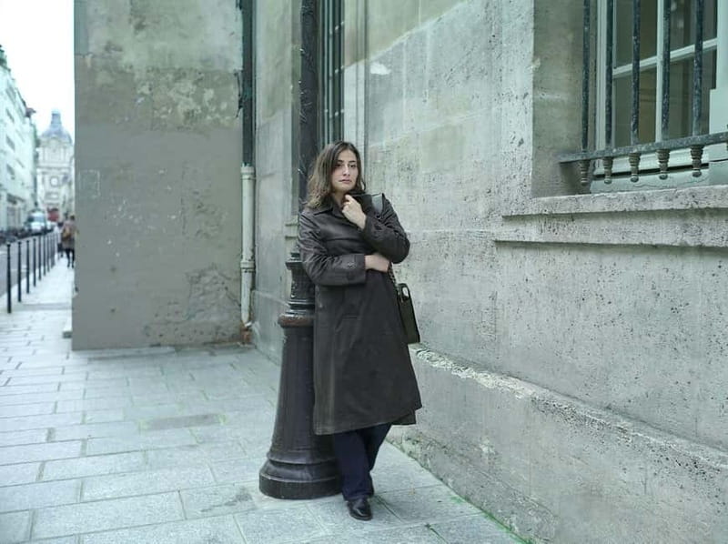 Paris: Private Marais District Photoshoot Plus 1 Polaroid - Meeting Valentine with a camera and green bag