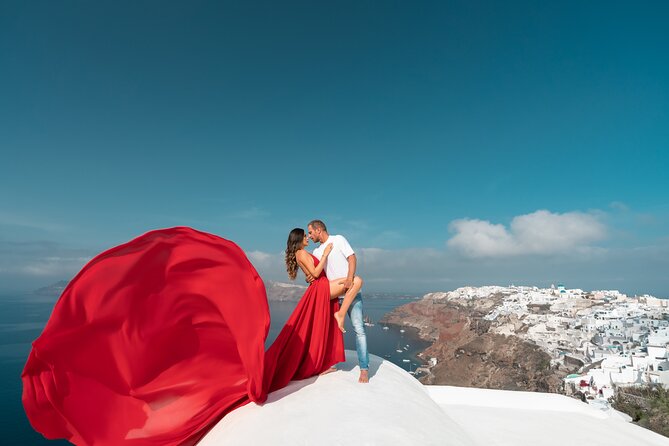 Private Flying Dress Photoshoot in Santorini - Oia brings the blue domes and postcard views