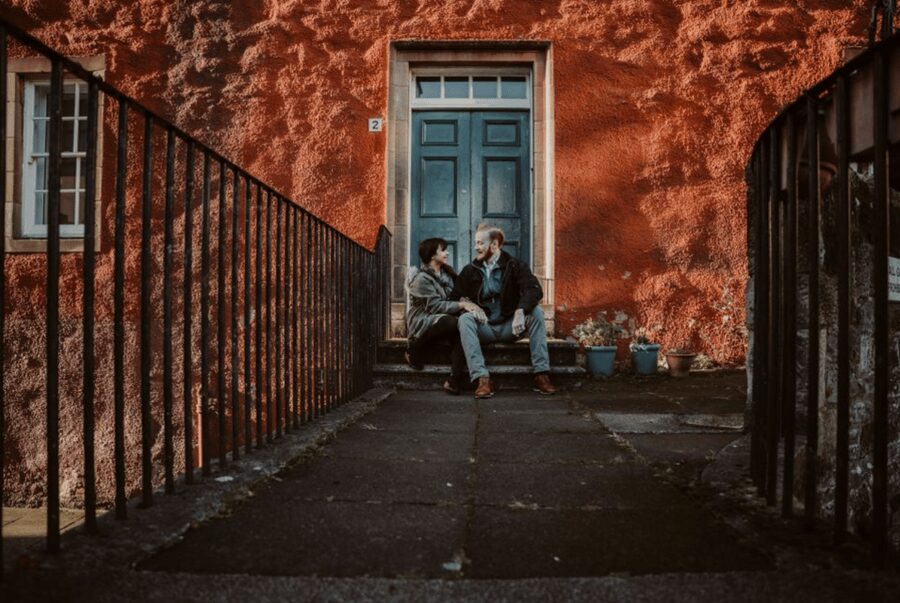 Private Photoshoot with Views of Famous Edinburgh Castle - Victoria Street and its colorful character