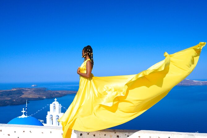 Santorini 2h Private Flying Dress Photoshoot with Transportation - The staff make the flying effect work