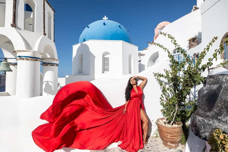 Santorini: Flying Dress Photoshoot <strong>Dress Included</strong> – Key points to know before you book’ /></p>
<ul>
<li><strong>Jessica Mocanu leads the shoot:</strong> You receive personal direction on poses, angles, and expression rather than being left to guess what looks natural.</li>
<li><strong>The dress rental is included:</strong> Choose from 15 colors and sizes from US 0 to 18, or XS to XL, with the catalog sent by email after booking.</li>
<li><strong>The one-hour option stays in Oia:</strong> You meet at the bus terminal and photograph around the blue domes, white buildings, and sea views.</li>
<li><strong>The three-hour option covers more ground:</strong> Transport, pickup, and drop-off are included, with stops in Oia, at black beach, and near Imerovigli.</li>
<li><strong>You receive finished digital images:</strong> Expect 35 edited photos with the one-hour choice or 70 with the three-hour choice, delivered by link in 7 to 10 days.</li>
<li><strong>The private format suits different groups:</strong> Book for yourself, a couple, or best friends, with a dress for each woman in the friends option.</li>
</ul>
<h2>A flying dress in Santorini, with real help behind the camera</h2>
<p><img width="800" height="504" decoding="async" src=