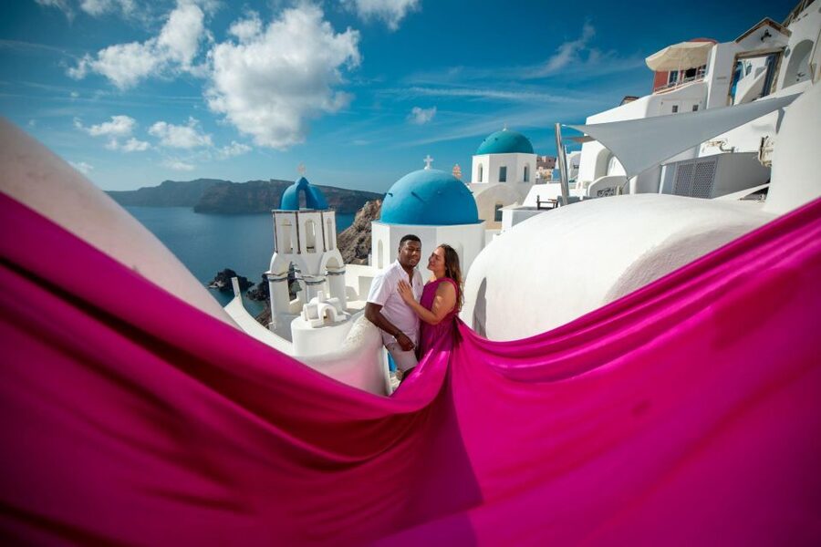 Santorini: Unique Flying Dress Photoshoot Experience - Oia photos with a little movie magic