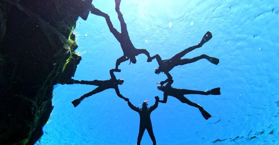 Silfra: Half-Day Snorkeling Day Trip with Underwater Photos - Getting into the drysuit