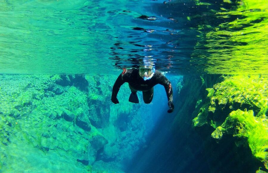 Silfra: Half-Day Snorkeling Day Trip with Underwater Photos - Guides, safety, and first-time confidence
