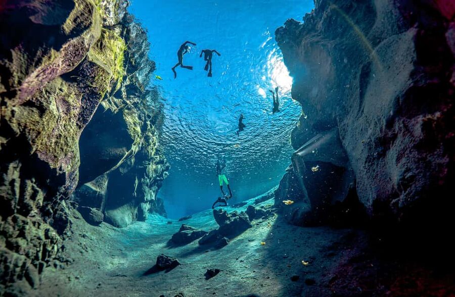 Silfra: Snorkel Between Continents. Free Professional Photos - Entering Silfra with a six-person group