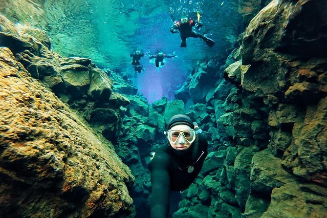 Silfra Wetsuit Snorkeling - Meet on Location | Free Photos - The safety briefing and first steps in the water