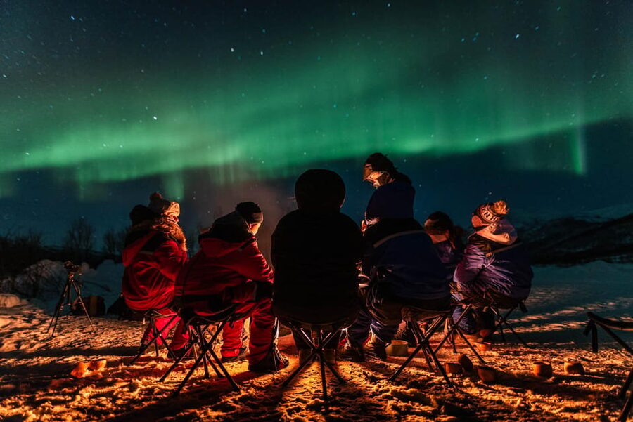 Tromsø: Aurora Tour with Photos, Campfire and Arctic Food - Campfire, reindeer sausage, and homemade chai